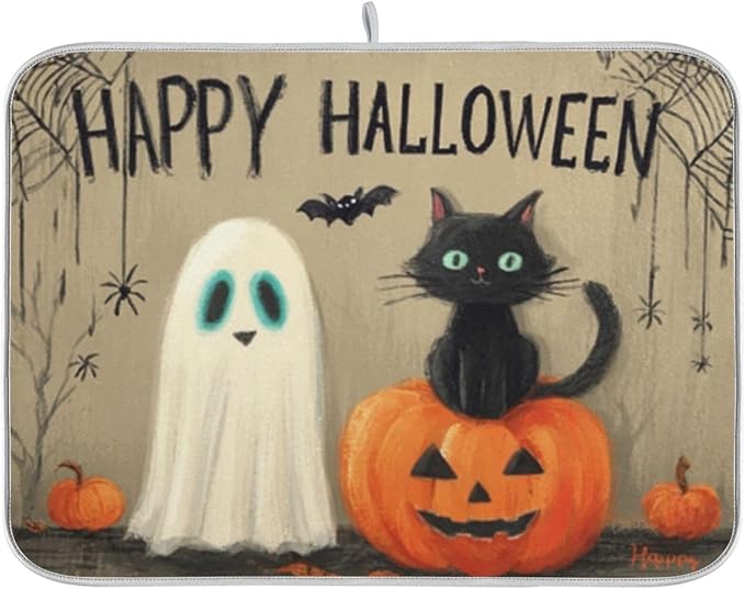 cute black cat an orange pumpkin